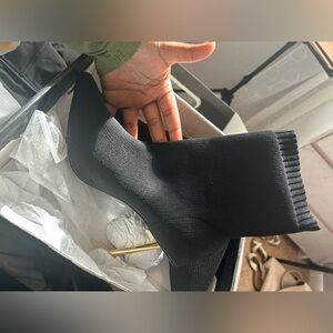 A black sock fit pointed toe booties